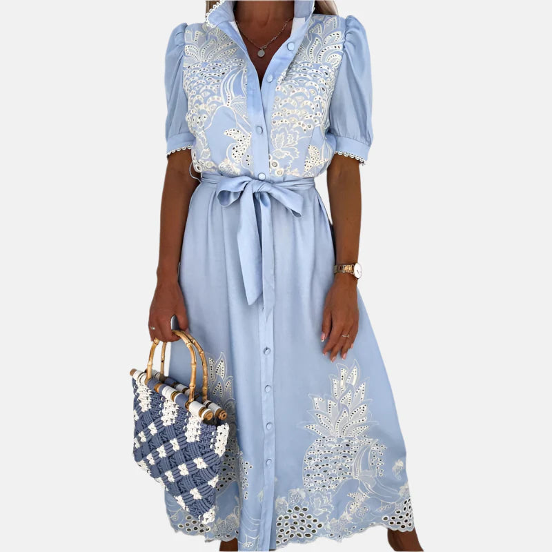 Abito blu ricamato da donna con dettagli eleganti