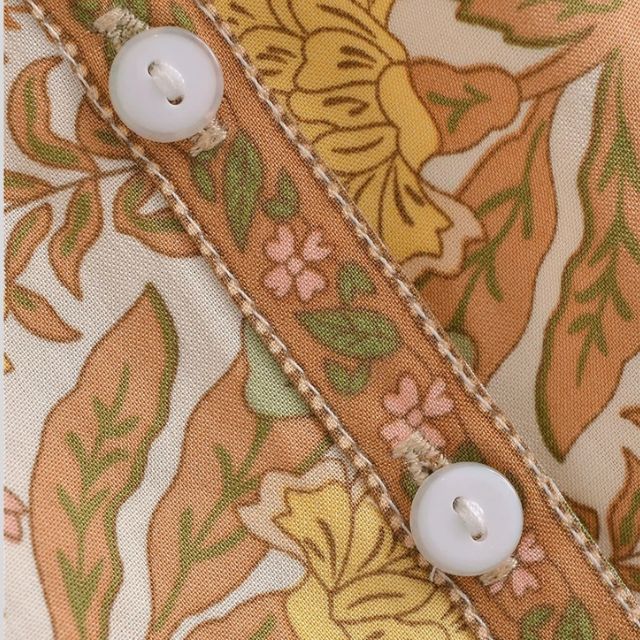 Camicetta bohémien con dettagli di nappe